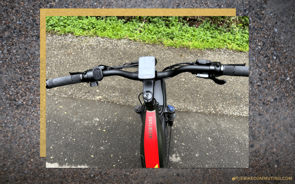 Left handlebar has a throttle and control for the LCD Display (center). Right side has 8-speed shifter.