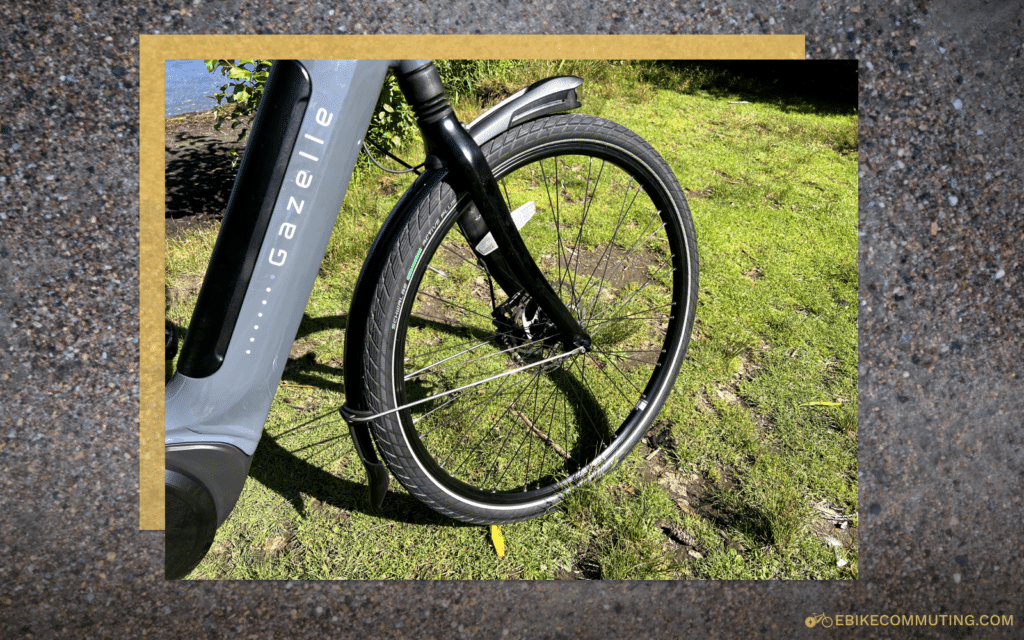 Close up view of the front tire with rain fender and integrated headlight