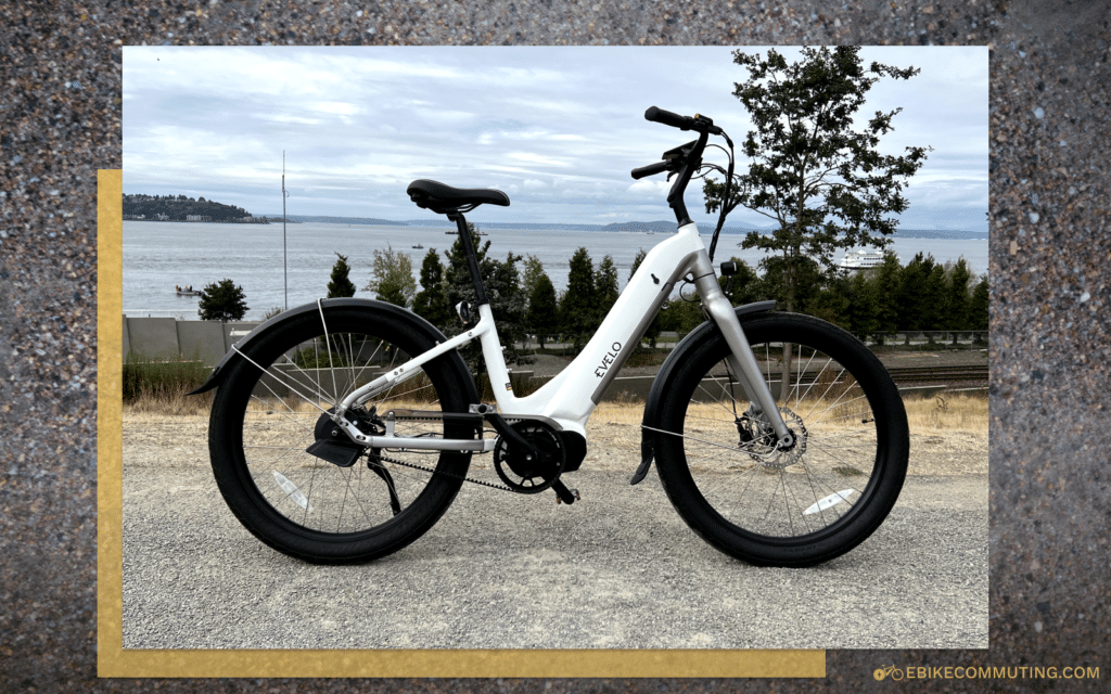 Side angle view of a white Omega e-bike in front of the Puget Sound.